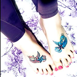 Colorful Tattoos on Feet Showcasing Ink Art
