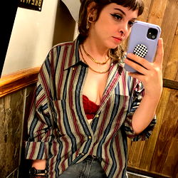 Woman in Striped Shirt Taking Selfie