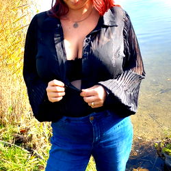 Fashionable Woman Standing by Water