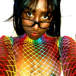 Vibrant OnlyFans Model Posing in Colorful Fishnet Outfit