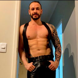 Muscular OnlyFans Model Mister Leather Brazil Striking a Pose in His Leather Outfit