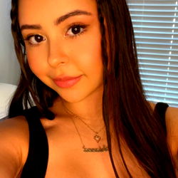 Woman Taking Selfie in Black Tank Top