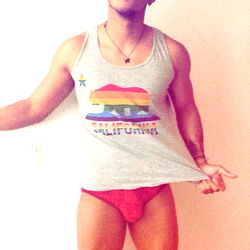 Futuristic Fitness Model Papá de Romeo with Colorful Rainbow Tank Top and Sunglasses