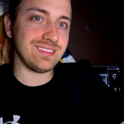 A young man from Pennsylvania with a beard, showcasing an indoor room