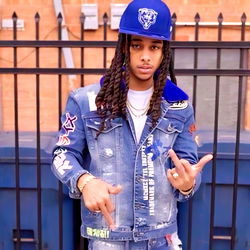 Fashionable Rapper in Jacket and Jeans with Blue Baseball Cap