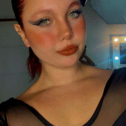 Beautifully Made-up Model Posing for Selfie