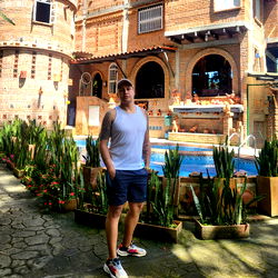 Male Model in Front of Resort-Style House