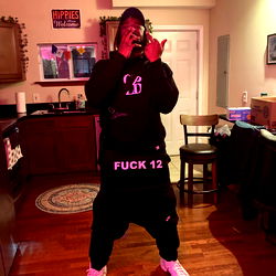 Onlyfans Model Strikes Pose in Hoodie, Sneakers, and Black Belt