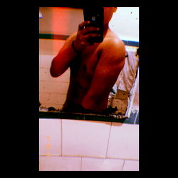 Shirtless Man in Bathroom Mirror, Reflecting a Fitness Journey