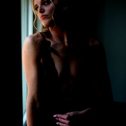 A Model Reflects in a Window