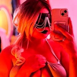 Amelia Royal in a Seductive Black Mask and Bra