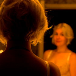 Stylish Model Looking into Mirror