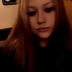 Young Adult Female with Long Hair and Tattoos