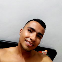 Cesar, A 28-Year-Old Model Posing in a Shirtless Photo