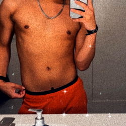 Toni from SoCal, shirtless in a bathroom mirror