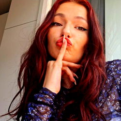 Red-haired woman making the 