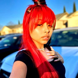 Stylish Sav wu in a red outfit with ponytail,