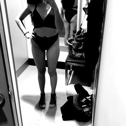 Model Walking Through Fashion Store Aisle