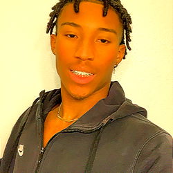 A Young Man Posing for a Photo with the Hashtag #SATURDAYMOOD