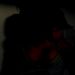 A Close-Up Of A Person's Face In Black And White, Possibly Captured On The Web