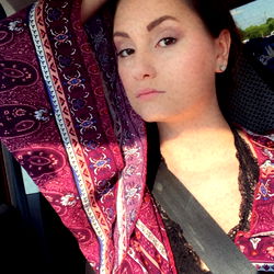 Anna, the Carbondale OnlyFans Model, Poses in a Vibrant Peacock Robe