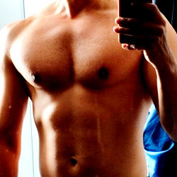 Fit and Muscular Model Aneurythm Shooting in Front of Mirror