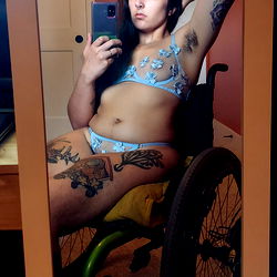 Reggie, an OnlyFans model, showcases her unique style in a captivating photo shoot