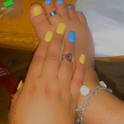 Close-up of Hands with Colorful Nail Polish