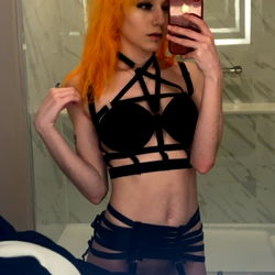 Angel, OnlyFans Model, in Stylish Black and Orange Outfit