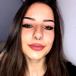 A young woman with striking facial features