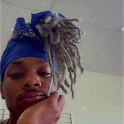 A Young Man with Blue Hair and a Blonde Ponytail