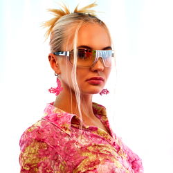 Olya Honey in Vibrant, Floral Shirt and Sunglasses