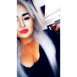 Blonde-haired female model with a neutral expression and lips