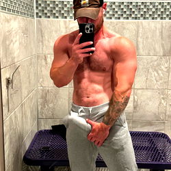 Bodybuilder AlphaDomBrad in Gym Showing Off Muscles