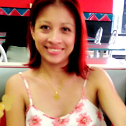Venezuelan Woman Smiling in Restaurant