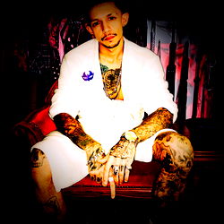 OnlyFans Model Poses with Tattoos and Gun Accessories