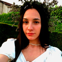 Asya Swan in White Dress, Wearing Floral Headpiece