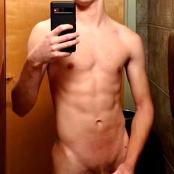 Young Man's Shirtless Selfie in Bathroom
