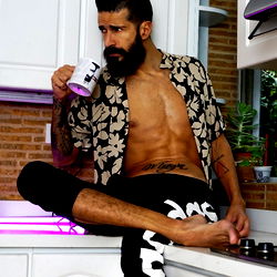 Fitness Influencer Cristian Cipriani Sitting at Kitchen Counter