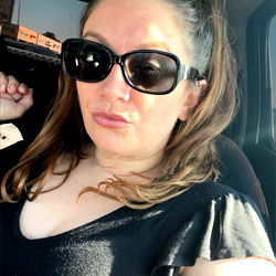 Beautiful Brunette Woman in a Car