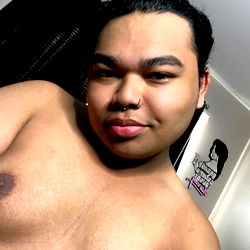 Ahsian, a young and confident adult model posing for OnlyFans.