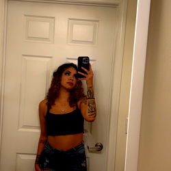 Model Jaybaby in a Bathroom Mirror