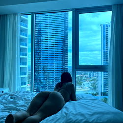 Model Leah in a serene urban setting,