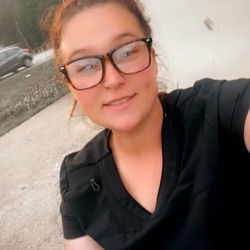 Girl posing in front of a building