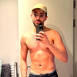 A Young Man in a Shirtless State, Ready to Hit the Gym