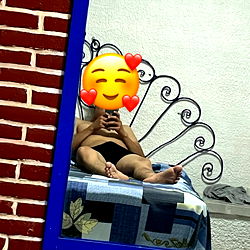 A Playful Selfie with a Brick Wall Mirror