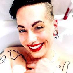 Rae, a Canadian OnlyFans Model with a Smile and Tattoos