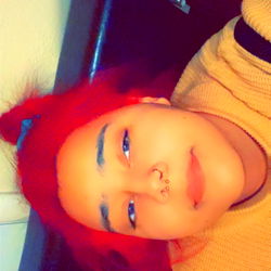 Stylish Person with Red Hair