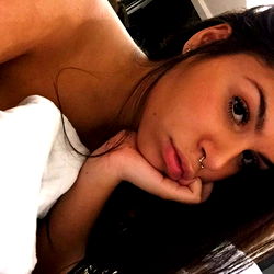 Brazilian beauty resting in bed