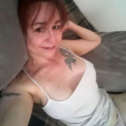 Texas Beauty: A Sensual Tattooed Model in a Gray Tank Top